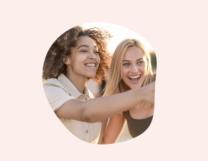 Two smiling women taking a selfie together